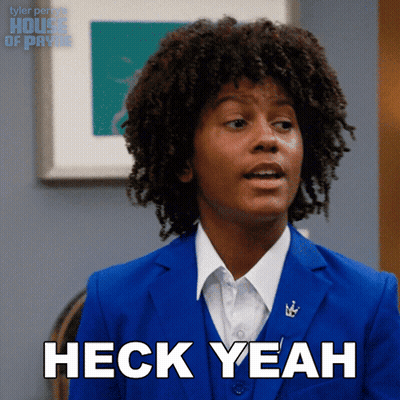 A Man In A Blue Suit Is Saying Heck Yeah GIF