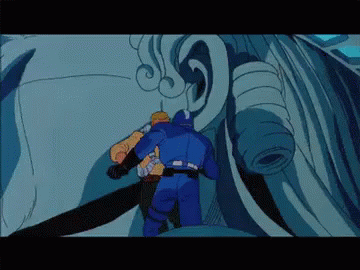 A Man In A Blue Suit Is Standing Next To Another Man In A Yellow Suit GIF