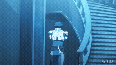 A Man In A Blue Suit Is Walking Down A Set Of Stairs With Netflix Written On The Bottom GIF