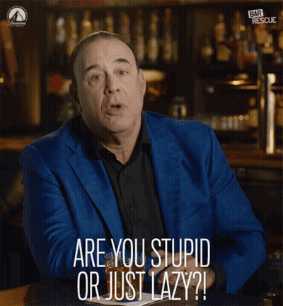 a man in a blue suit says " are you stupid or just lazy ? "