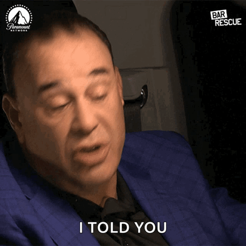A Man In A Blue Suit Says " I Told You " In Front Of A Paramount Network Logo GIF
