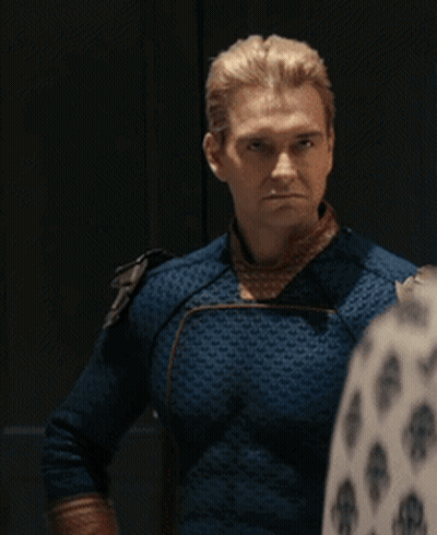 A Man In A Blue Superhero Costume Is Standing Next To Another Man GIF