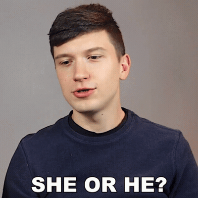 A Man In A Blue Sweater Is Asking The Question She Or He GIF