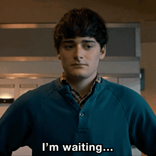 A Man In A Blue Sweater Says I 'M Waiting ... GIF