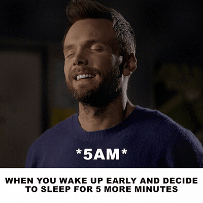 A Man In A Blue Sweater With His Eyes Closed And The Words * 5Am * Below Him GIF