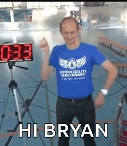 Man In Blue T-Shirt In Front Of Timer GIF