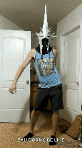 A Man In A Blue Tank Top And Shorts Is Dancing In A Room With The Words Byu Dorms Be Like Below Him GIF