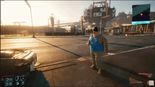 A Man In A Blue Tank Top Walking Down A Street In A Video Game GIF