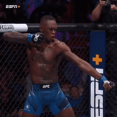 A Man In A Blue Ufc Shorts Is In A Cage GIF