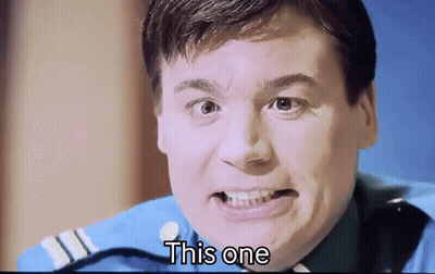 A Man In A Blue Uniform Is Making A Funny Face And The Words " This One " Are Next To Him GIF