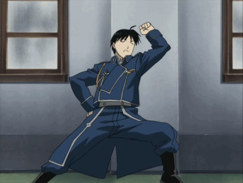 A Man In A Blue Uniform With A Fist In The Air GIF