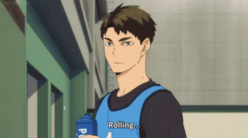A Man In A Blue Vest Is Holding A Water Bottle And Says `` Rolling '' . GIF
