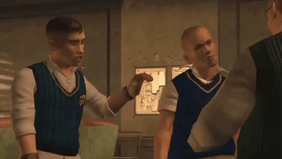 A Man In A Blue Vest Talks To Two Other Men GIF