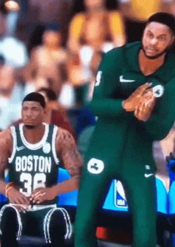 A Man In A Boston Jersey Sits On The Bench During A Basketball Game GIF
