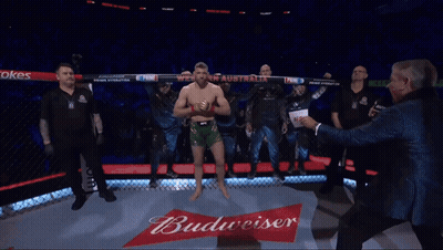 A Man In A Boxing Ring Holds A Sign That Says Western Australia GIF