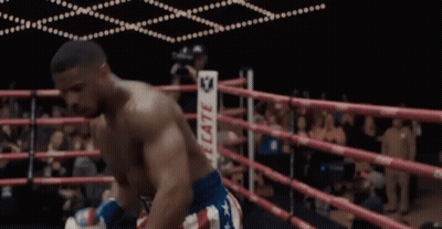 A Man In A Boxing Ring Wearing A Belt That Says ' Reed ' On It GIF
