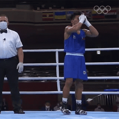 A Man In A Boxing Ring Wearing A Mask And Gloves GIF