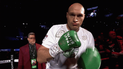 A Man In A Boxing Ring Wearing A Shirt That Says Mgm Grand On It GIF
