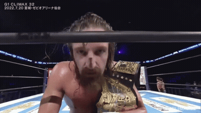 A Man In A Boxing Ring With A Belt That Says ' G1 Climax 32 ' On It GIF