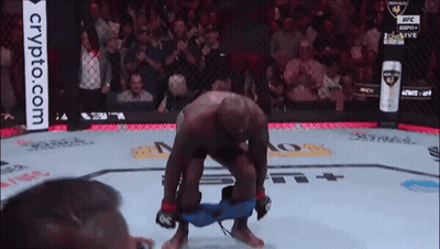 A Man In A Boxing Ring With A Crypto.com Advertisement In The Background GIF