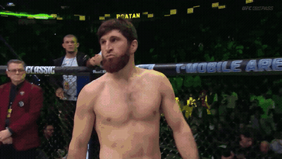 A Man In A Boxing Ring With A Sign That Says T Mobile Are Behind Him GIF