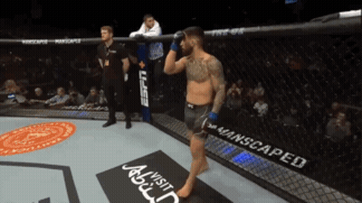 A Man In A Boxing Ring With A Sign That Says Visit Abdul GIF