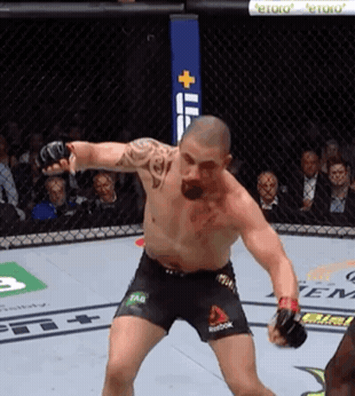 A Man In A Boxing Ring With Reebok Shorts On His Shorts GIF