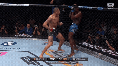 A Man In A Boxing Ring With The Ufc Logo On The Side GIF