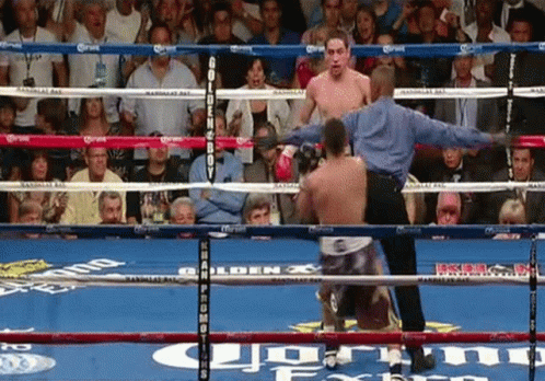 A Man In A Boxing Ring With The Word Corona On The Ring GIF