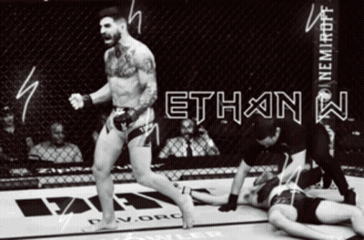 A Man In A Boxing Ring With The Word Ethan On The Wall GIF