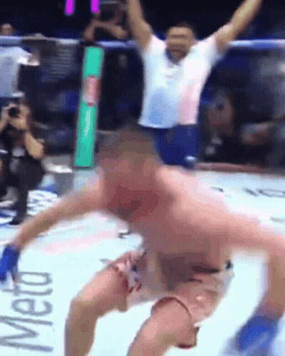 A Man In A Boxing Ring With The Word Meto On The Wall GIF