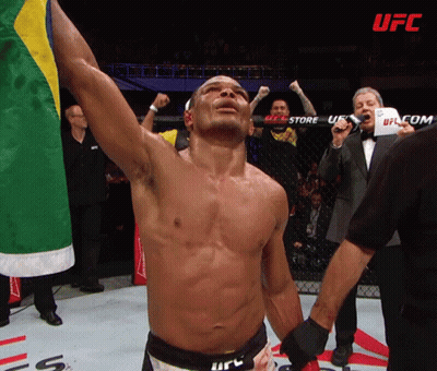 A Man In A Boxing Ring With The Word Ufc In The Background GIF