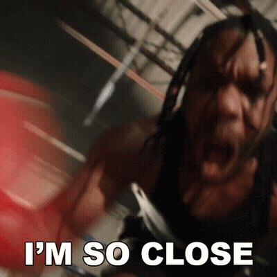 A Man In A Boxing Ring With The Words " I 'M So Close " Above Him GIF