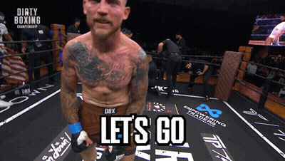 A Man In A Boxing Ring With The Words Let 'S Go Written On The Floor GIF