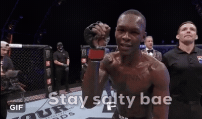 A Man In A Boxing Ring With The Words " Stay Salty Bae " On The Bottom GIF