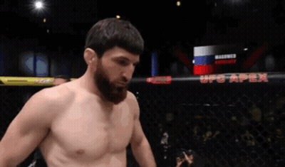 A Man In A Boxing Ring With Ufc Apex In The Background GIF