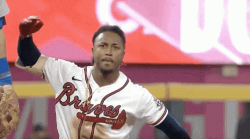 A Man In A Braves Jersey Throws A Ball GIF