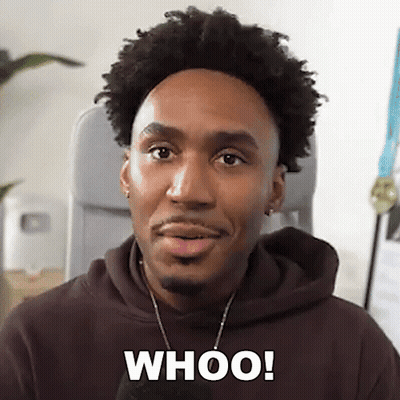 A Man In A Brown Hoodie Is Making A Funny Face And Saying Whoo ! GIF