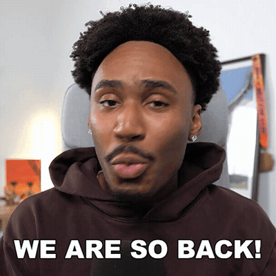 A Man In A Brown Hoodie With The Words We Are So Back Behind Him GIF