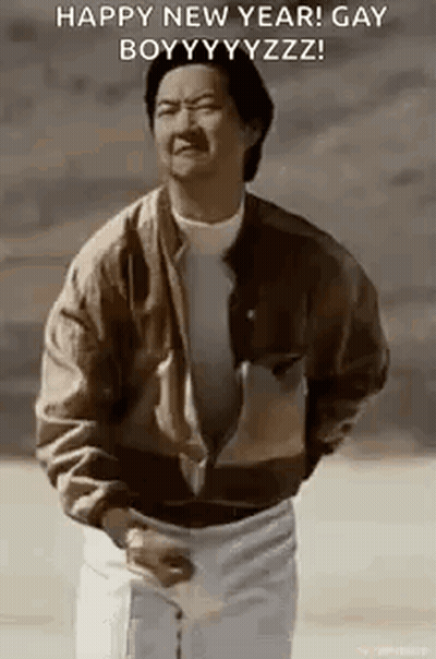 A Man In A Brown Jacket Is Standing In Front Of A Sign That Says Happy New Year ! GIF