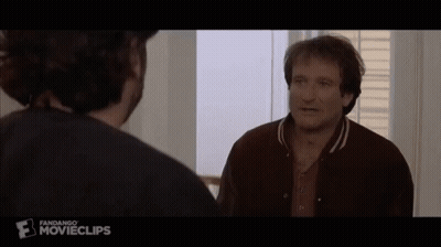 A Man In A Brown Jacket Is Talking To Another Man In A Movie Clip GIF