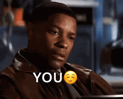 A Man In A Brown Jacket Says " You " With A Smiley Face GIF