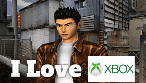 A Man In A Brown Jacket Stands In Front Of A Sign That Says " I Love Xbox " GIF
