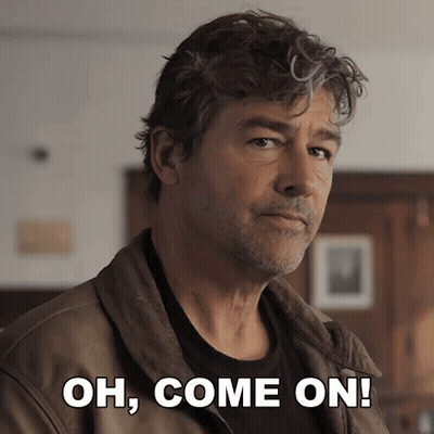A Man In A Brown Jacket With The Words Oh Come On Behind Him GIF