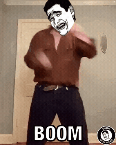 A Man In A Brown Shirt Is Dancing With The Word Boom Written On The Floor Behind Him GIF