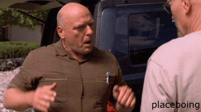 A Man In A Brown Shirt Is Talking To Another Man In A White Shirt With Placeboing Written On The Bottom GIF