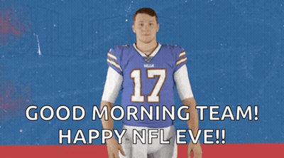 A Man In A Buffalo Bills Jersey Is Waving His Hand GIF