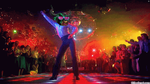 A Man In A Bull Mask Is Dancing In A Disco Club GIF
