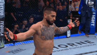 A Man In A Cage With A Banner That Says Horne On It GIF