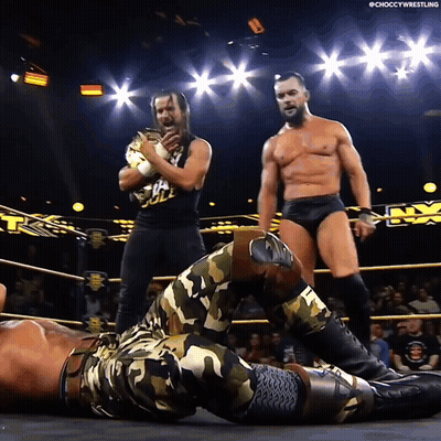 A Man In A Camo Outfit Is Laying On The Ground In A Ring GIF